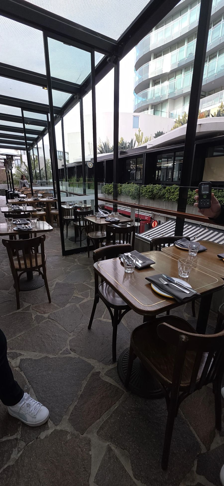 Glass enclosed outdoor dining terrace